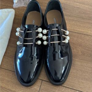 Chic Black Loafers with Pearl Accents